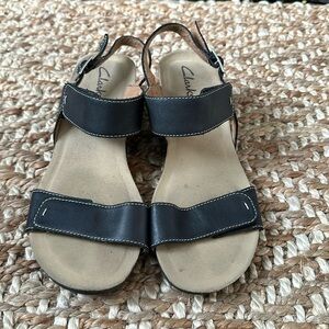 Clarks Black Leather Sandal
Adjustable Heel and Foot Strap
Women's Size 8.5 M